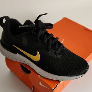 Nike Black and Gold Sneakers with Mesh and Lace-Up Design